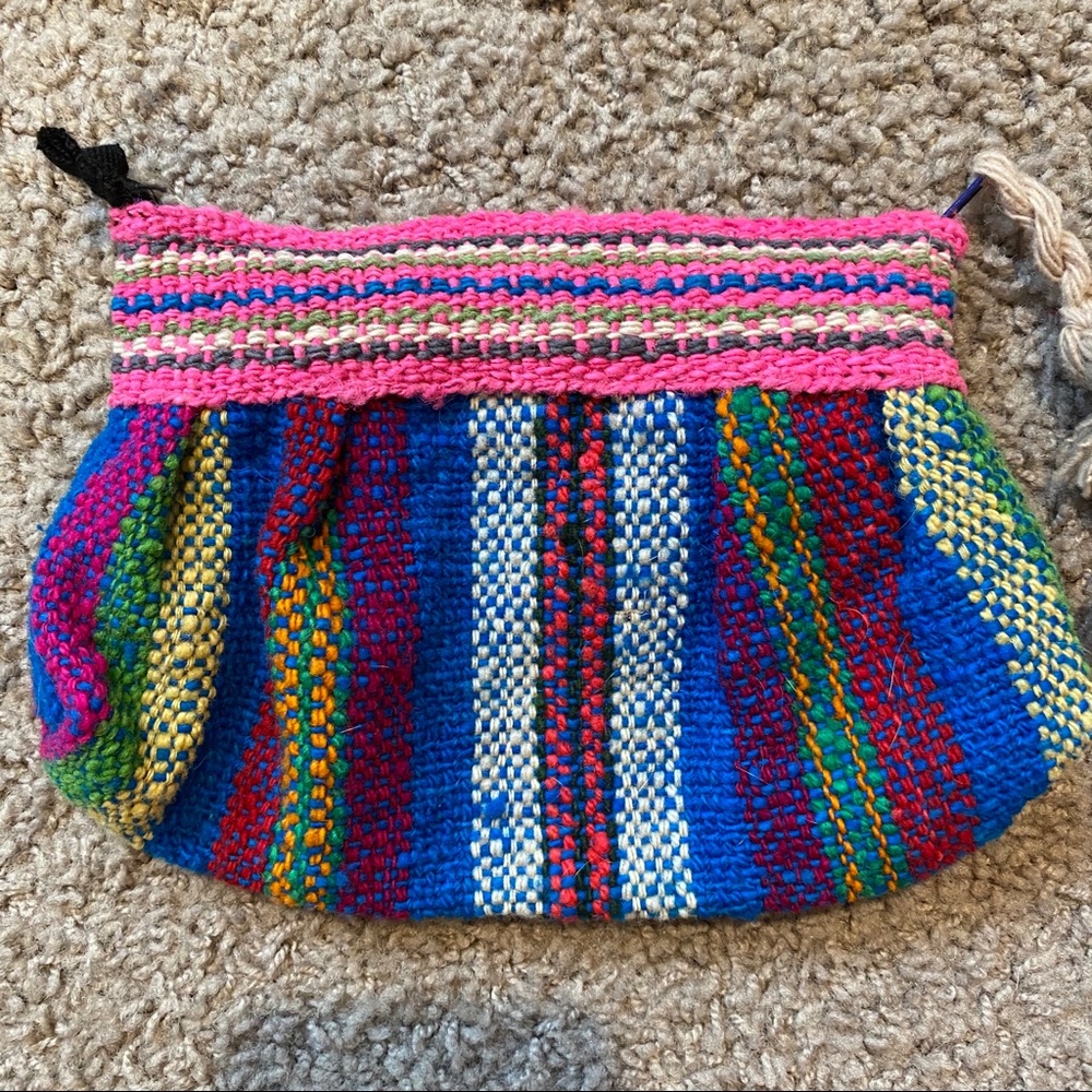 Artisan woolen woven pouch with tassel zip